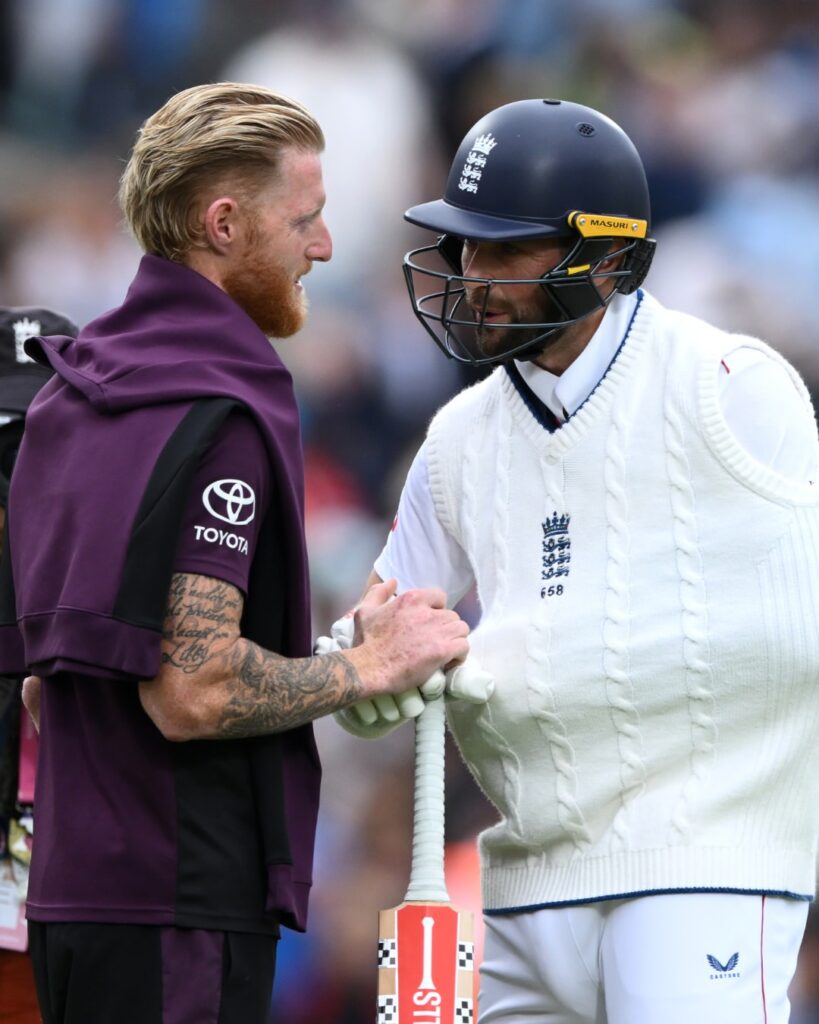 a man shaking hands with another man
